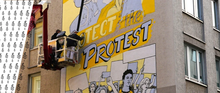 An einer Hausmauer in Wien entsteht ein neues Mural. @ Harald Wandl / Amnesty International